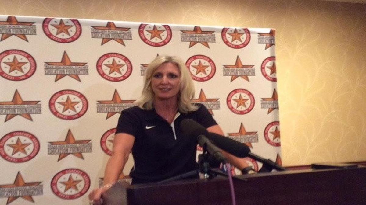 Incoming UIL athletic director Susan Elza, the Northwest ISD AD, addresses reports at the Texas HS Coaches Association convention in 2015.