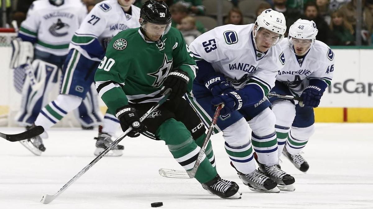 Jason Spezza, trying to control the puck in Friday’s game against Vancouver, and the Dallas Stars play the second of a back-to-back Tuesday night in Detroit against the Red Wings. Fox Sports Southwest has the telecast starting at 6:30 p.m.
