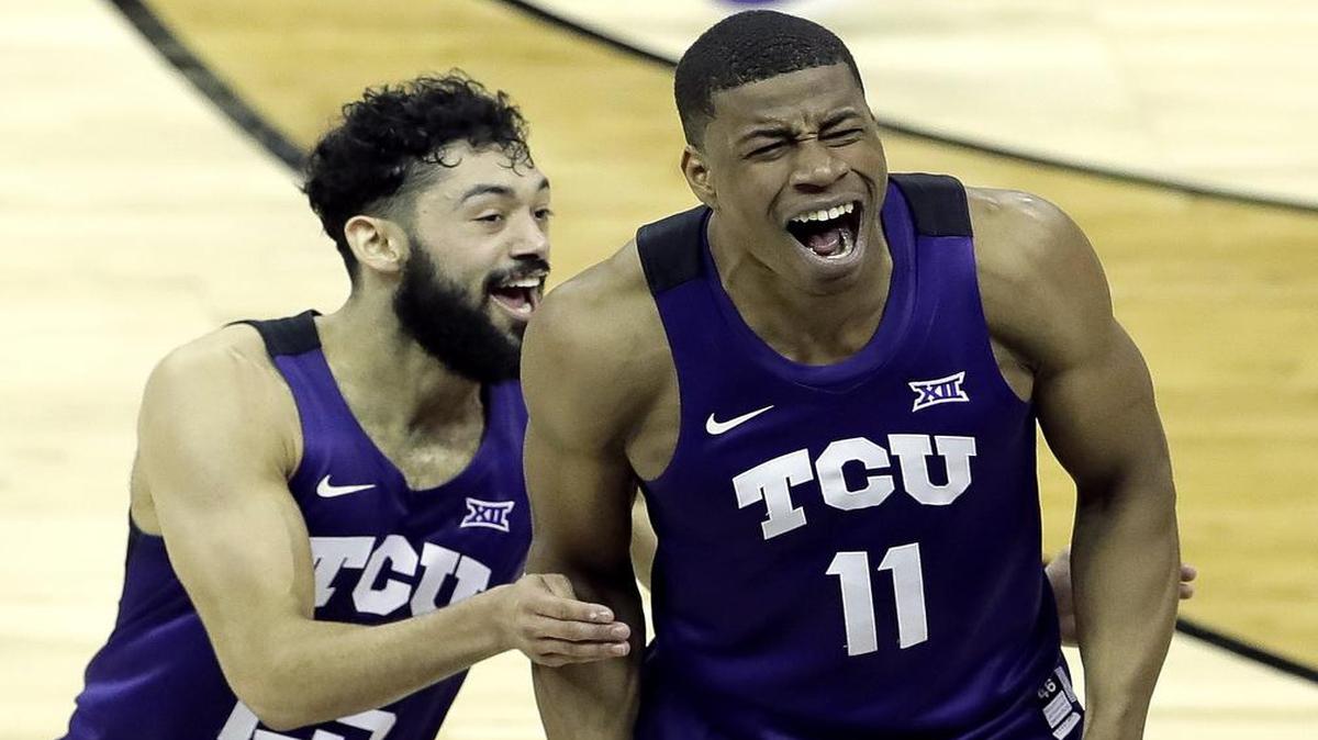 TCU guards Alex Robinson, left, and Brandon Parrish (11) celebrate after their 85-82 upset of Kansas on Thursday in the Big 12 quarterfinals. The Horned Frogs advance to play Iowa State in the semifinals Friday. The game will be televised at 6 p.m. on ESPN2.