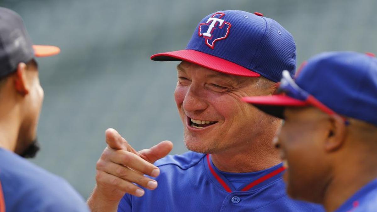 Texas Rangers manager Jeff Banister (28) visits with friends before a game against the Houston Astros. The Rangers and Astros wrap up their first series of the season at 7:05 p.m. Thursday.