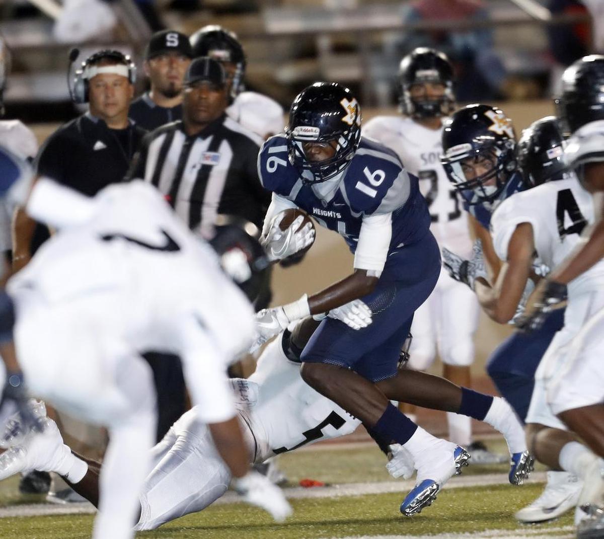 Arlington Heights’ Tariq Woolen is surrounded by the South Hills defense.