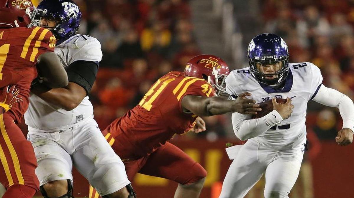 
TCU Horned Frogs quarterback Trevone Boykin (2) breaks away from Iowa State Cyclones defensive end Darius White (41) in the third quarter. 
