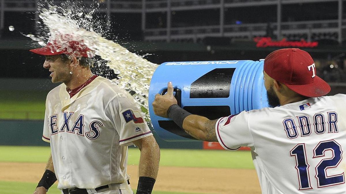 Jared Hoying, left, Rougned Odor and the Texas Rangers hope to take another victory splash Friday when they head to Detroit to take on the Tigers. The game will be televised at 6:10 p.m. on Fox Sports Southwest.