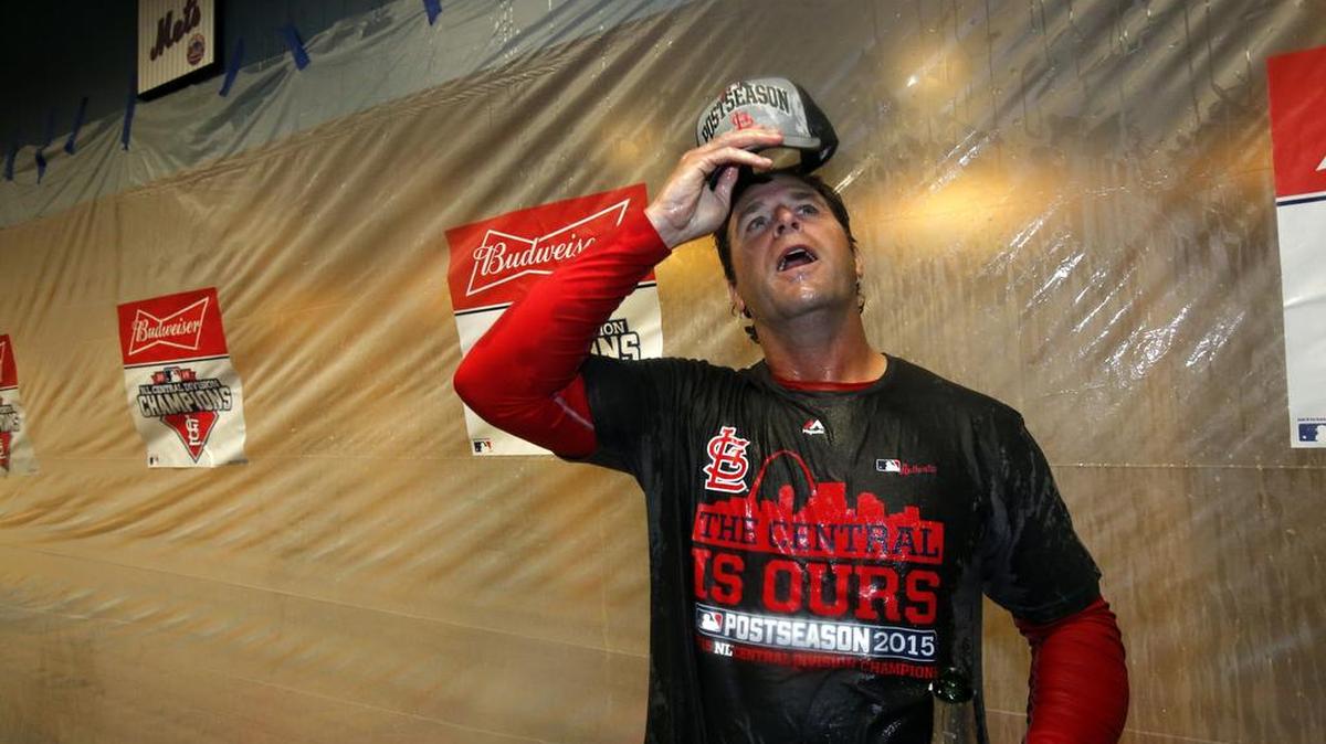 St. Louis Cardinals manager Mike Matheny was doused with champagne and beer by his players after the Cardinals clinched the Central Division with an 11-1 win over the Pittsburgh Pirates on Sept. 30, 2015.