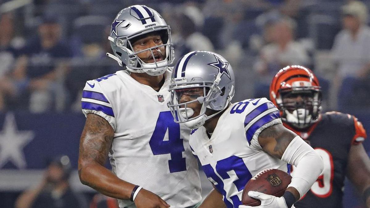 Dallas Cowboys wide receiver Terrance Williams (83) is congratulated by Dallas Cowboys quarterback Dak Prescott (4) after scoring a touchdown in the second quarter as the Cincinnati Bengals play the Dallas Cowboys in the first home pre-season game in Arlington, Saturday, August 18, 2018.
