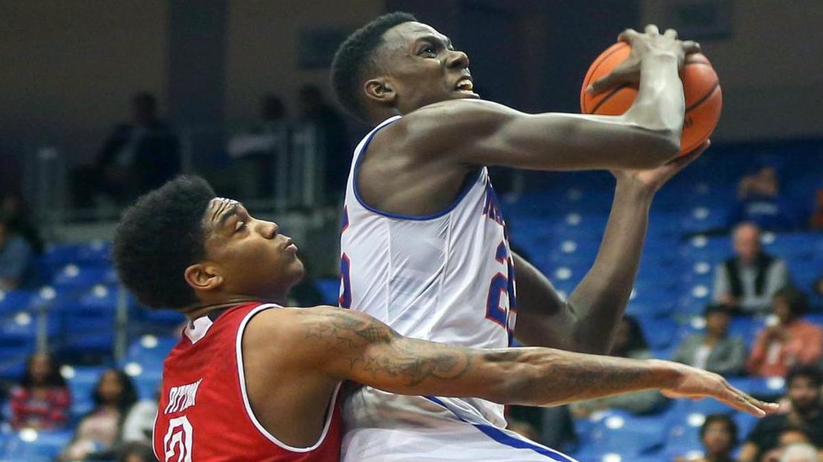 UTA center Kevin Hervey, right in action last season, and the Mavericks travel to Austin on Tuesday to take on Texas. Coverage begins at 7 p.m. on Longhorn Network.