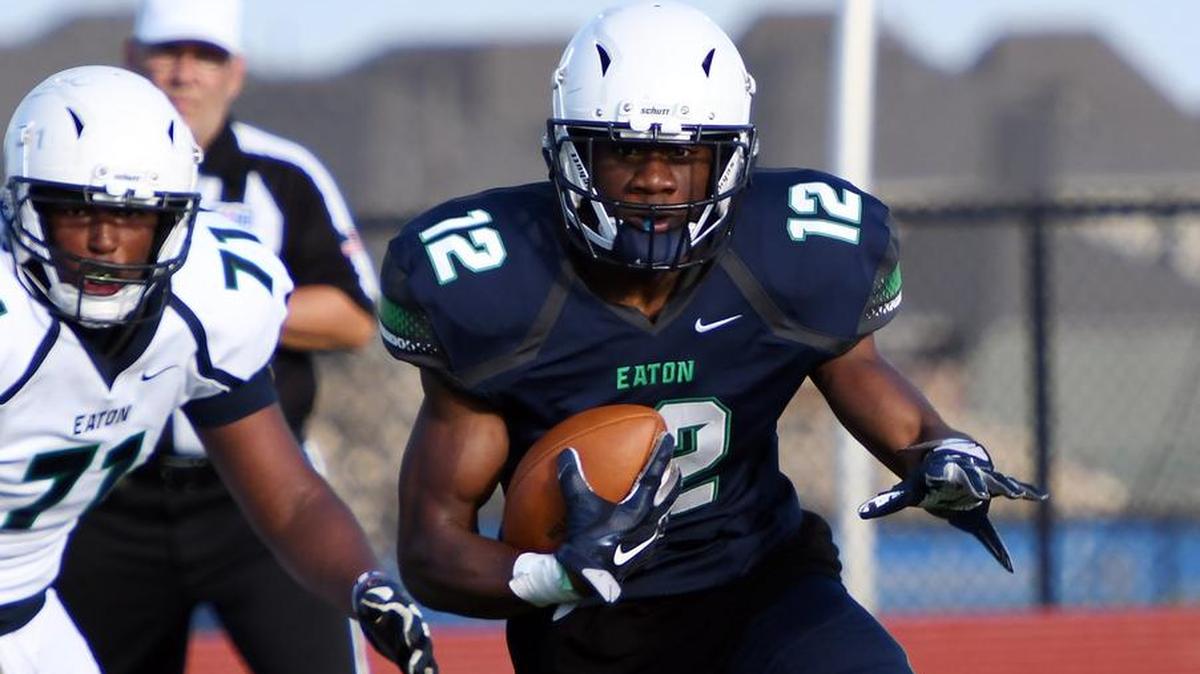 Eaton Navy Team’s Oscar Moore finds some running room for a first down in the second quarter of Saturday’s May 20, 2017 spring football game at Eaton High School in Haslet, Texas. Green Team won 20-7.
