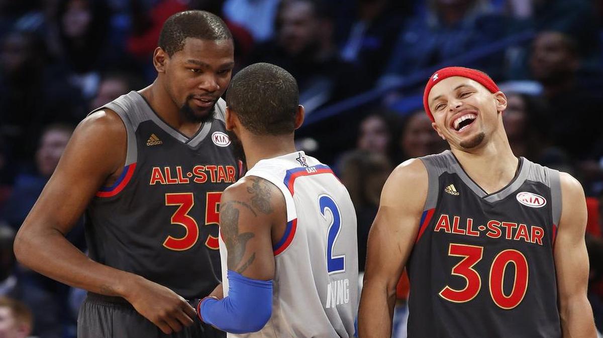 All-Stars Kevin Durant, left, chatting with Kyrie Irving, and Stephen Curry return to action Thursday with the Golden State Warriors in the nightcap of a TNT doubleheader against the Los Angeles Clippers. Coverage is scheduled to begin at 9:30 p.m.