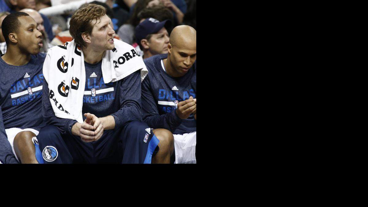 
Dallas Mavericks forward Dirk Nowitzki (41) looks on from the bench during the first half of a basketball game against the Houston Rockets, Friday, February 20, 2015, at the American Airlines Center, Dallas,Texas. 
