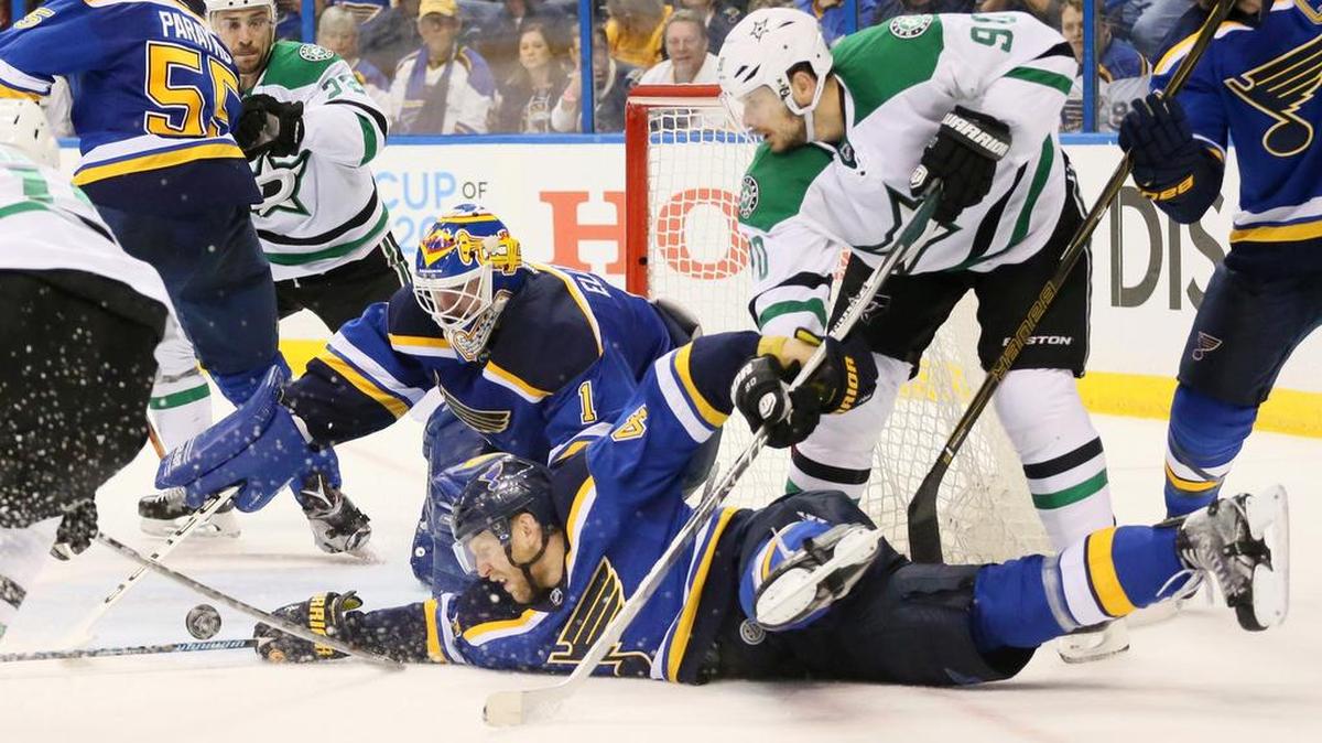 St. Louis Blues defenseman Carl Gunnarsson (4) and goaltender Brian Elliott try to defend as the Dallas Stars’ Jason Spezza, right, pressures in the second period of Game 3 on Tuesday. Game 4 is at 7 p.m. Thursday on NBCSN. The Blues lead the series 2-1 after a 6-1 victory Tuesday night in St. Louis.