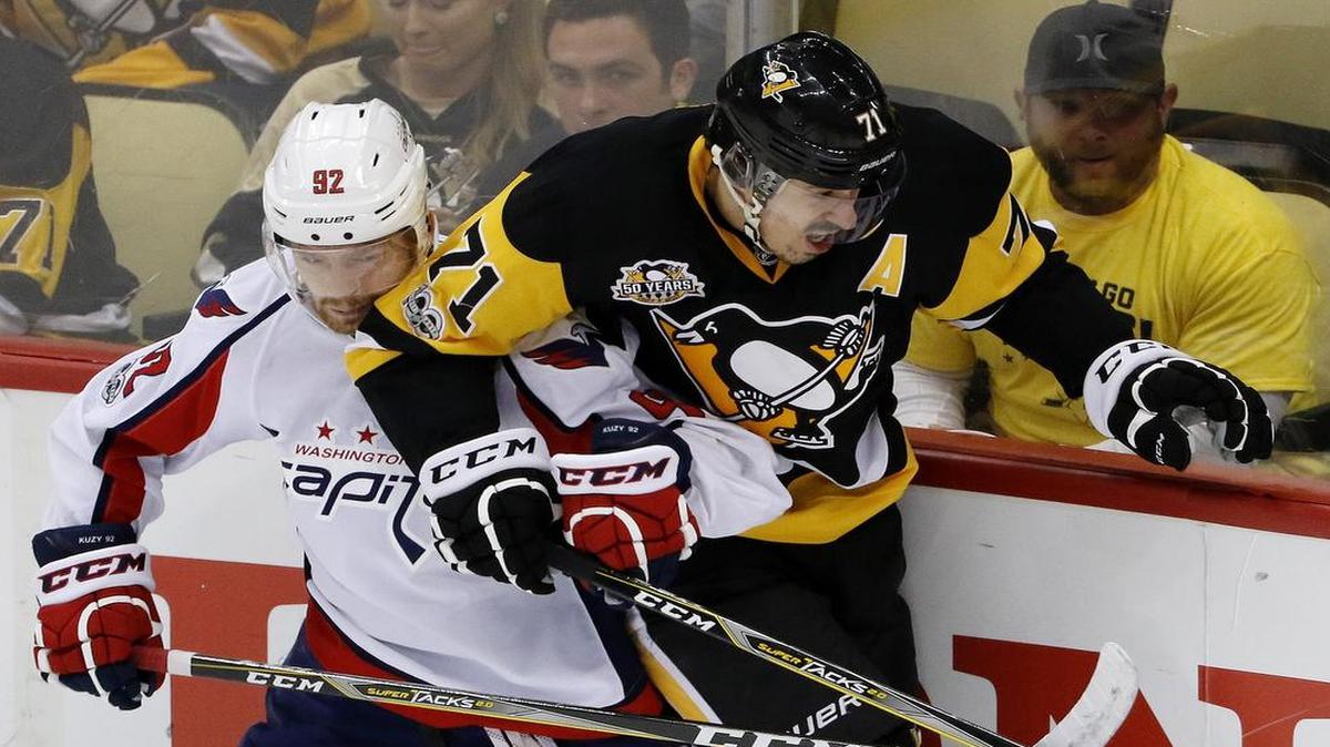 Evgeny Kuznetsov, left, and the Washington Capitals tussle with Evgeni Malkin and the Pittsburgh Penguins on Wednesday in Game 7 of the Eastern Conference semifinals. The deciding game will be televised at 6:30 p.m. on NBCSN.