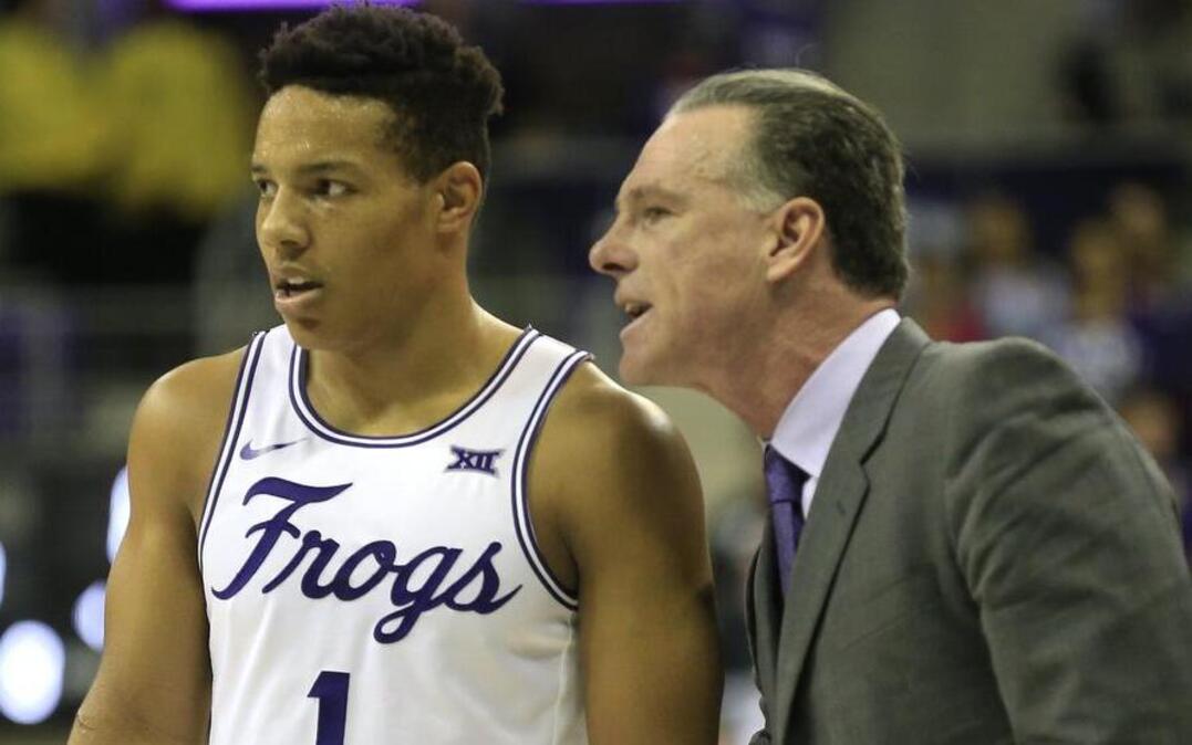 TCU coach Jamie Dixon, right, talks with guard Desmond Bane during Saturday’s loss to West Virginia. The Horned Frogs try to snap a five-game losing streak Wednesday at home against Kansas State. The game will be televised at 8 p.m. on ESPNU.