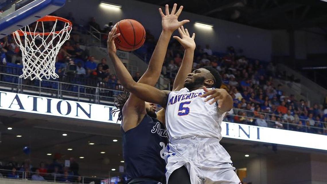 UTA guard Kaelon Wilson, right, driving in for a layup around Akron forward Kwan Cheatham Jr., scored a team-high 18 points Monday to fuel the Mavericks’ victory.