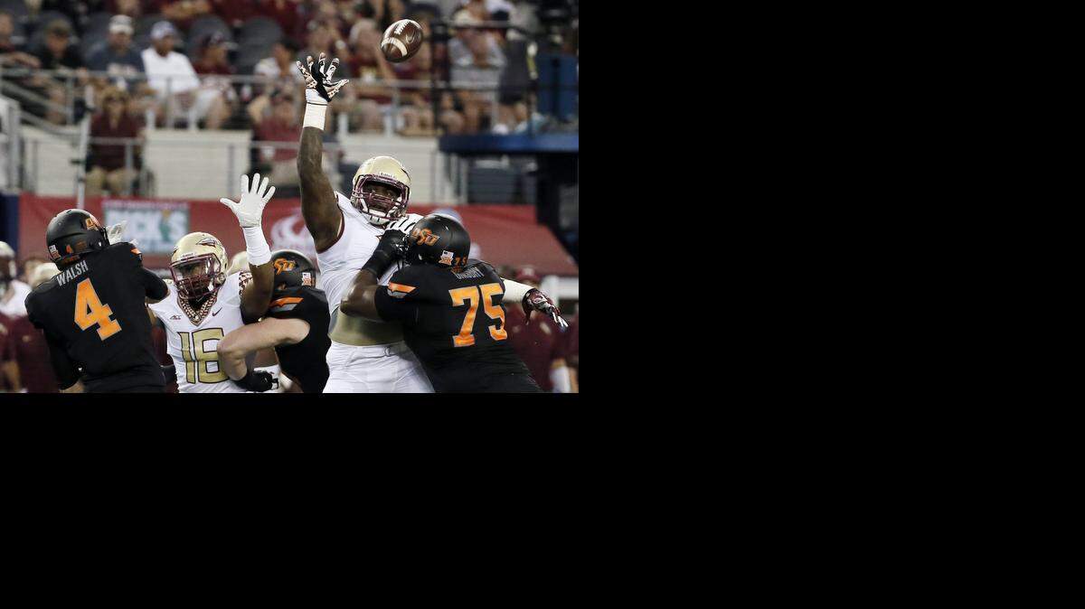 
Florida State defensive end and former Denton Ryan star Mario Edwards, Jr., blocks a pass against Oklahoma State in the season opener at AT&T Stadium.
