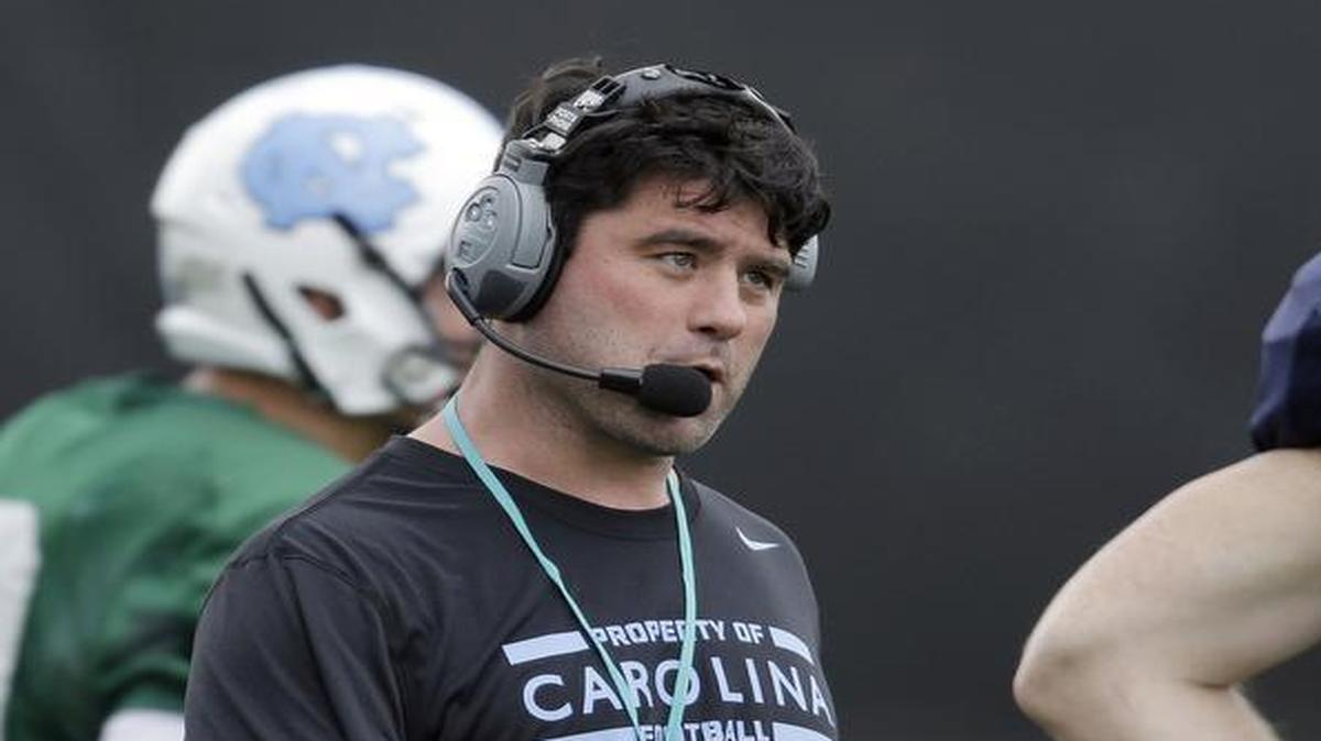 Seth Littrell, center, served as offensive coordinator last season with North Carolina where he lead the Tar Heels to the ACC championship game against Clemson. He was introduced as the new North Texas coach on Dec. 7.