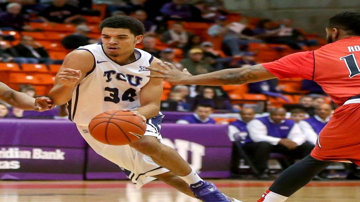 
TCU forward Kenrich Williams works against the defense of Texas Tech’s Robert Turner (left) and Aaron Ross during last year’s game in Fort Worth. Williams, who had 10 points and 16 rebounds in the 71-54 victory, will miss the coming season because of knee surgery.
