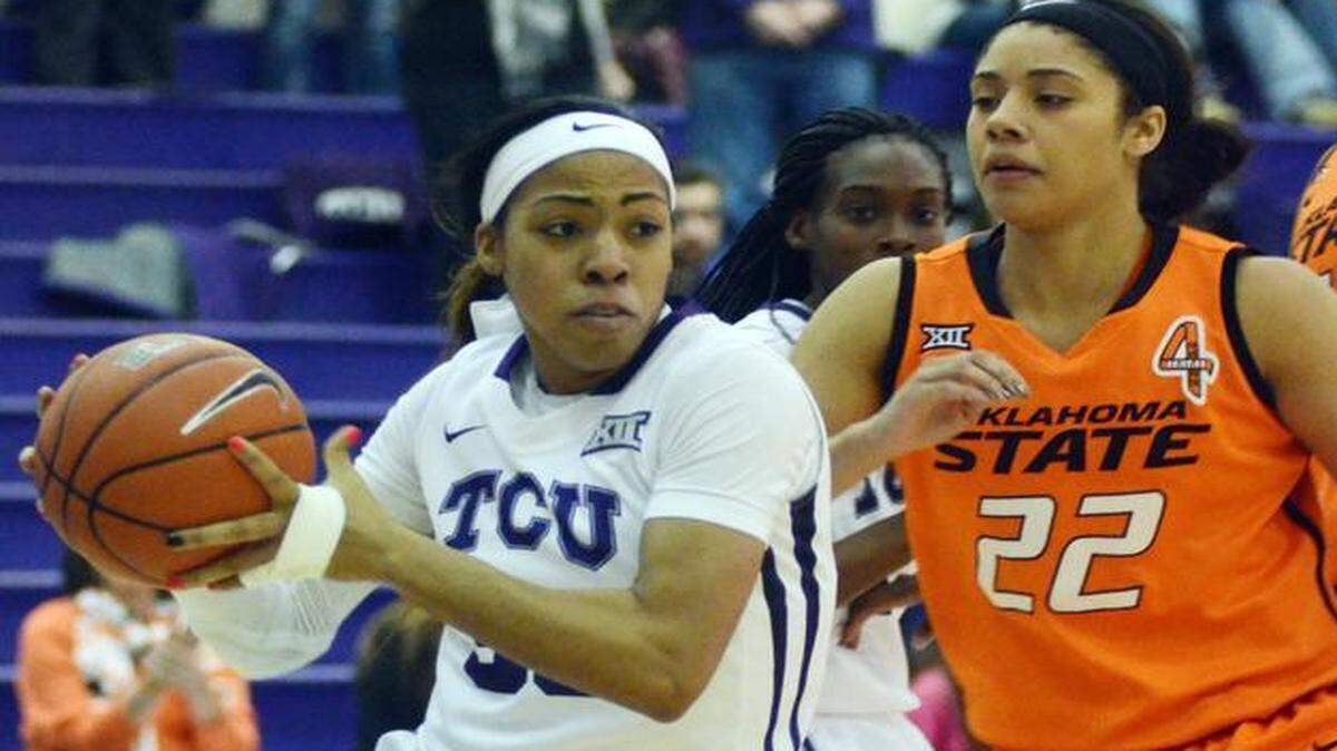 
TCU's Doneille Breaux, left, drives underneath the basket against Oklahoma State's Brittney Martin in the teams’ first meeting this season, Jan. 10 in Fort Worth. 
