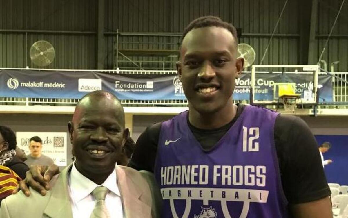 TCU newcomer Kouat Noi with this father, who lives in Melbourne. Noi, a 6-foot-7 guard, scored 20 points Saturday as the Horned Frogs defeated the Melbourne All Stars.