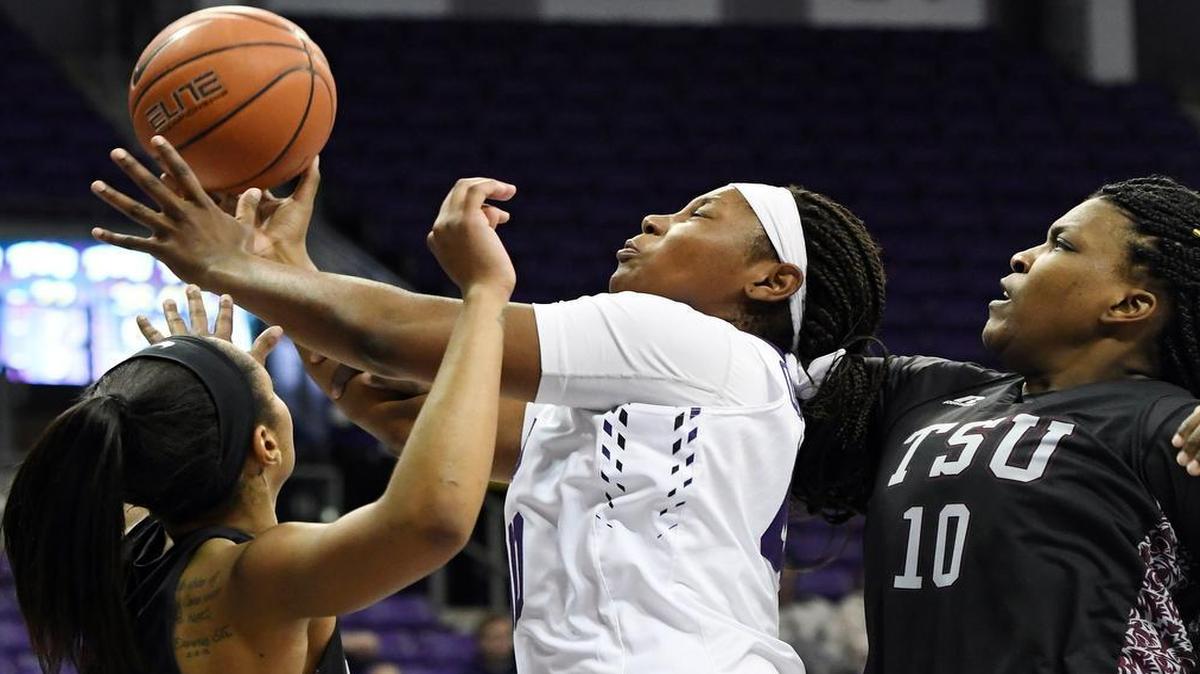 TCU’s Amy Okonkwo, center, draws the foul underneath the basket between Texas Southern’s Kaitlyn Palmer, left and Shamiya Brooks during the second quarter of Sunday’s December 18, 2016 womens basketball game at Schollmaier Arena, in Fort Worth, Texas.