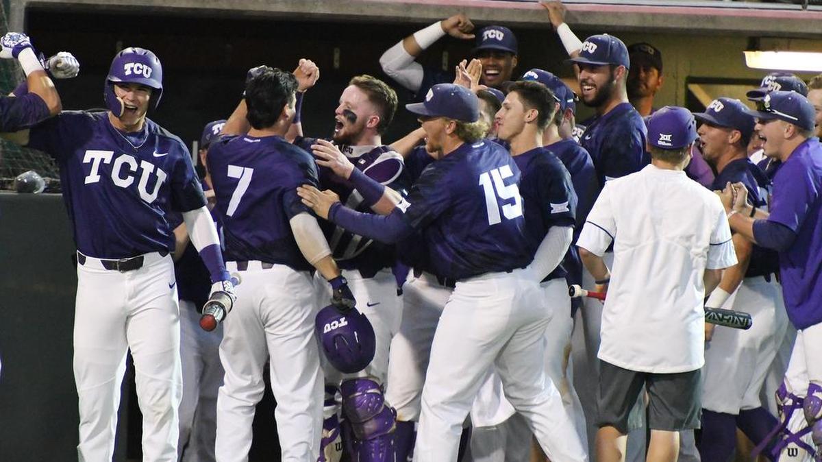 The TCU dugout celebrates with Josh Watson (7) after his two-run home run gave the Horned Frogs a 9-2 lead Monday.