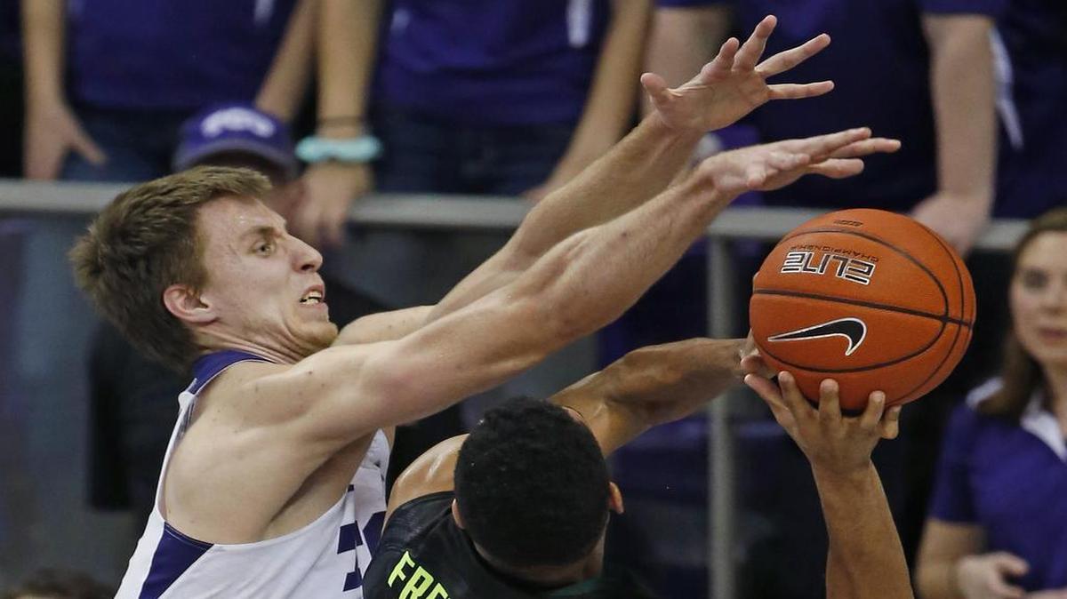 TCU Horned Frogs forward Vladimir Brodziansky (10) leaps to try to block a shot by Baylor Bears guard Al Freeman (25) in the second half as Baylor beats TCU 62-53 in Fort Worth, Saturday, January 21, 2017.
