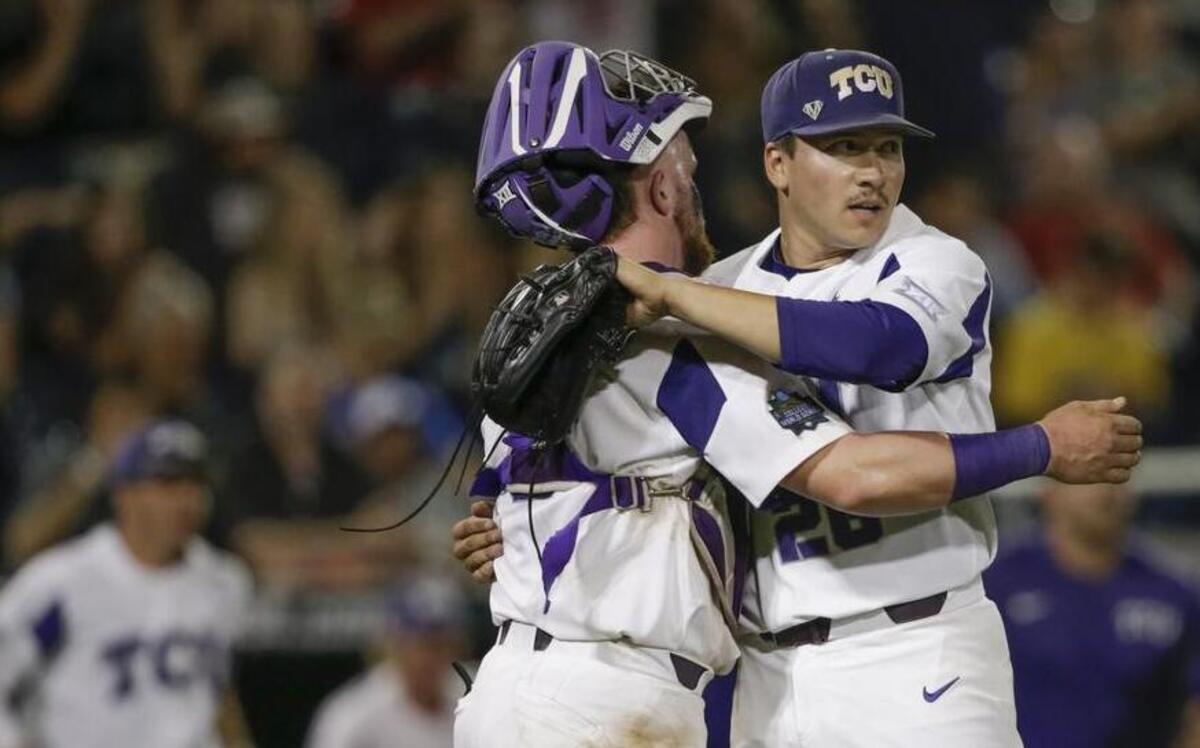 TCU pitcher Sean Wymer and catcher Evan Skoug embrace after the last out in a 4-3 victory against Louisville on Thursday in an elimination game at the College World Series. Wymer recorded the final 13 outs for the Horned Frogs with a one-run lead.