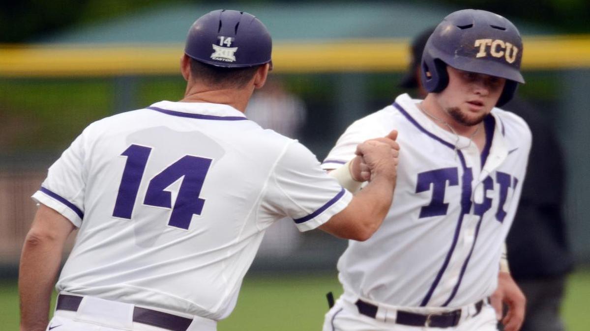 
Evan Skoug, right, gets a fist bump from associate coach Bill Mosiello, after Skoug hit the first of his two home runs Tuesday against Abilene Christian.
