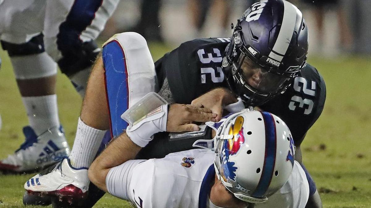 TCU linebacker Travin Howard brings down Kansas quarterback Peyton Bender for one of four sacks by the Horned Frogs in a 43-0 victory Oct. 21 at Amon G. Carter Stadium.