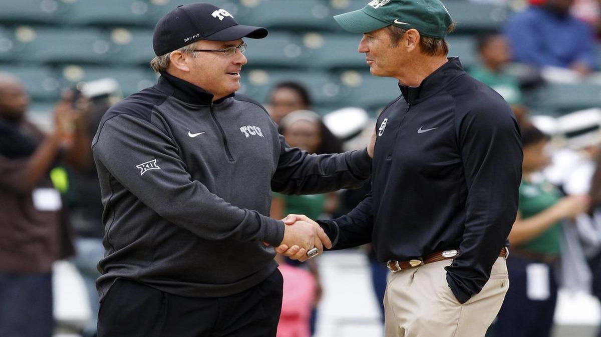 
TCU coach Gary Patterson and Baylor coach Art Briles shake hands as they wrap up their pre-game conversation on Oct. 11 last year. Baylor won the game, but the teams both ended the conference season with one loss, sharing the Big 12 championship.
