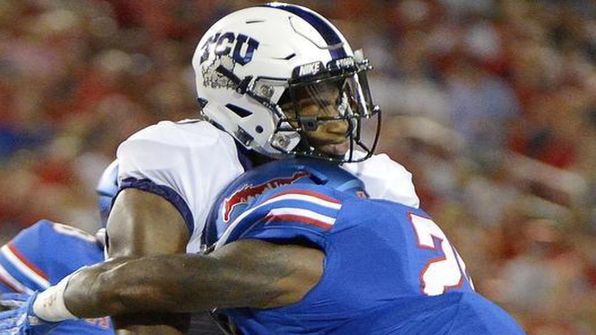 SMU defensive back Darrion Millines was ejected on this play for targeting TCU Horned Frogs wide receiver John Diarse during the second quarter.