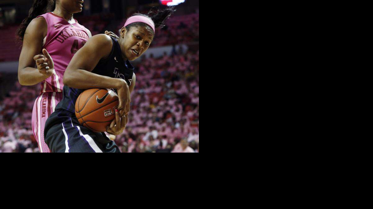 
TCU’s Jada Butts secures a rebound Saturday in front of Oklahoma’s Kaylon Williams.



