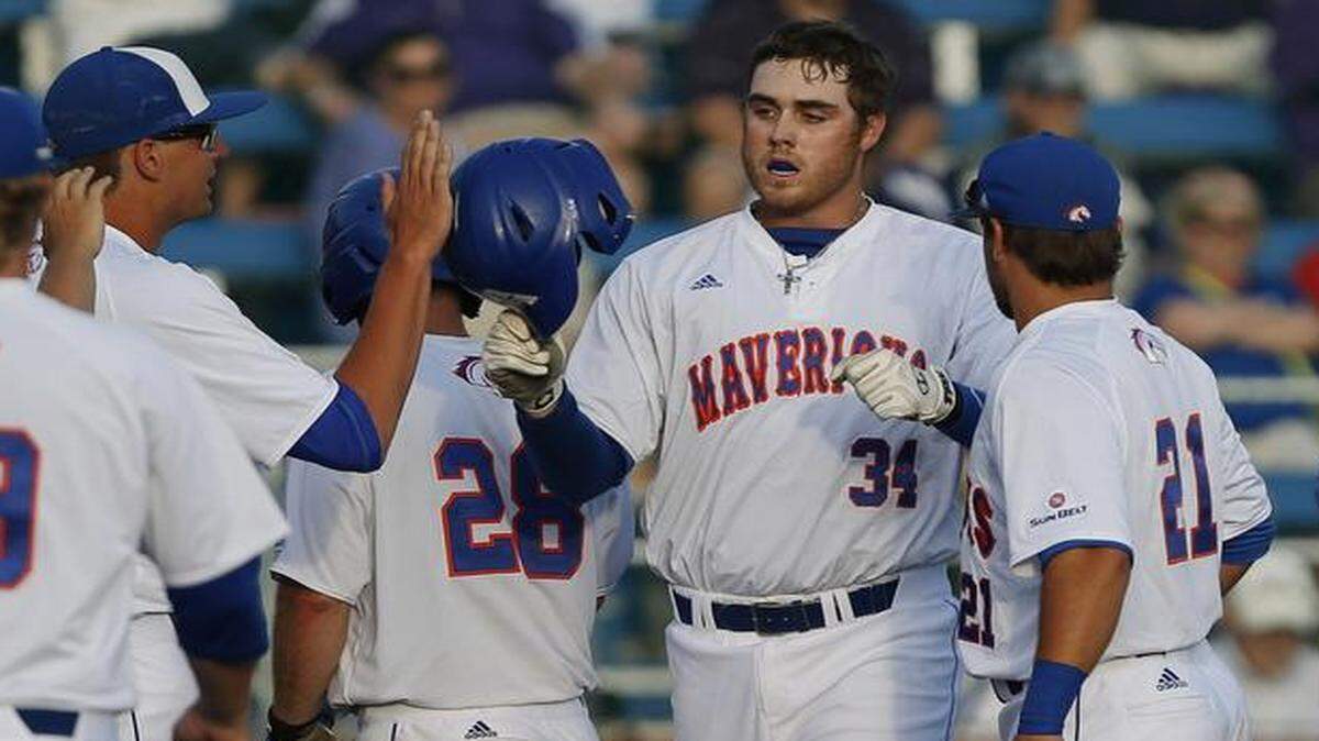 
UTA senior Levi Scott is congratulated by teammates after his first inning home run off Tyler Alexander.


