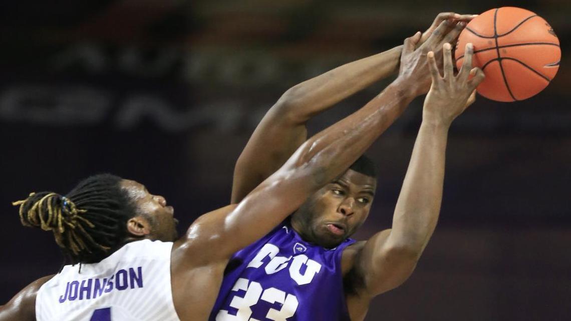 Kansas State forward D.J. Johnson (4) fouls TCU forward Chris Washburn (33) during the second half in Manhattan, Kan., on Wednesday. Kansas State defeated TCU 79-54.