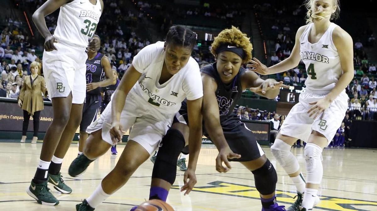 Baylor guard Niya Johnson, front left, and TCU center Jordan Moore, front right, reach for the loose ball in the first half Saturday in Waco.