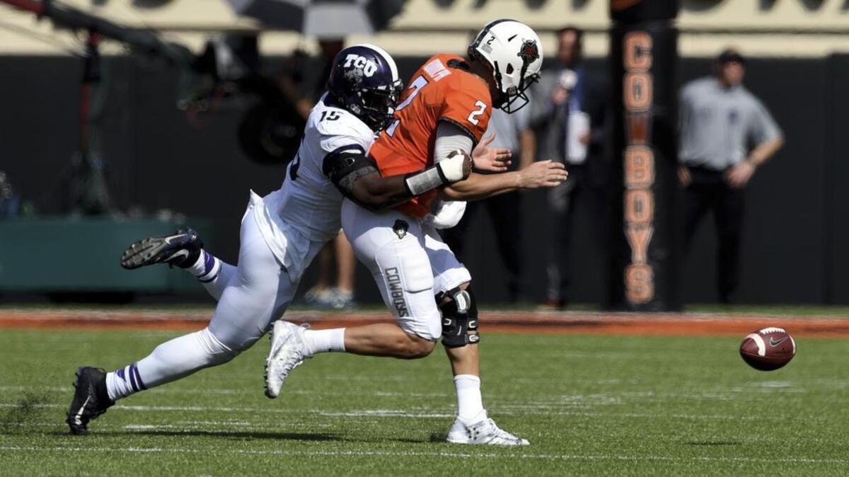 TCU defensive end Ben Banogu, pictured forcing a fumble with a sack of Oklahoma State quarterback Mason Rudolph, announced on his Instagram account Thursday that he is returning for his senior season.