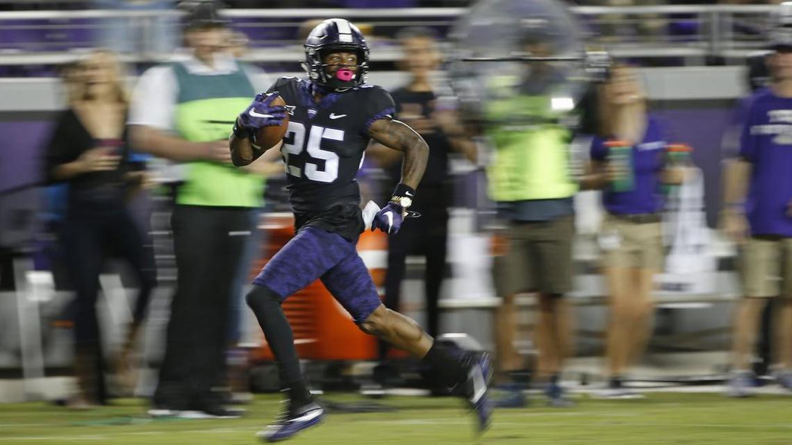 TCU returner KaVontae Turpin looks back for pursuit on his way to finishing a 90-yard punt return for a touchdown against Kansas. It was his third punt return for a touchdown in three years at TCU.