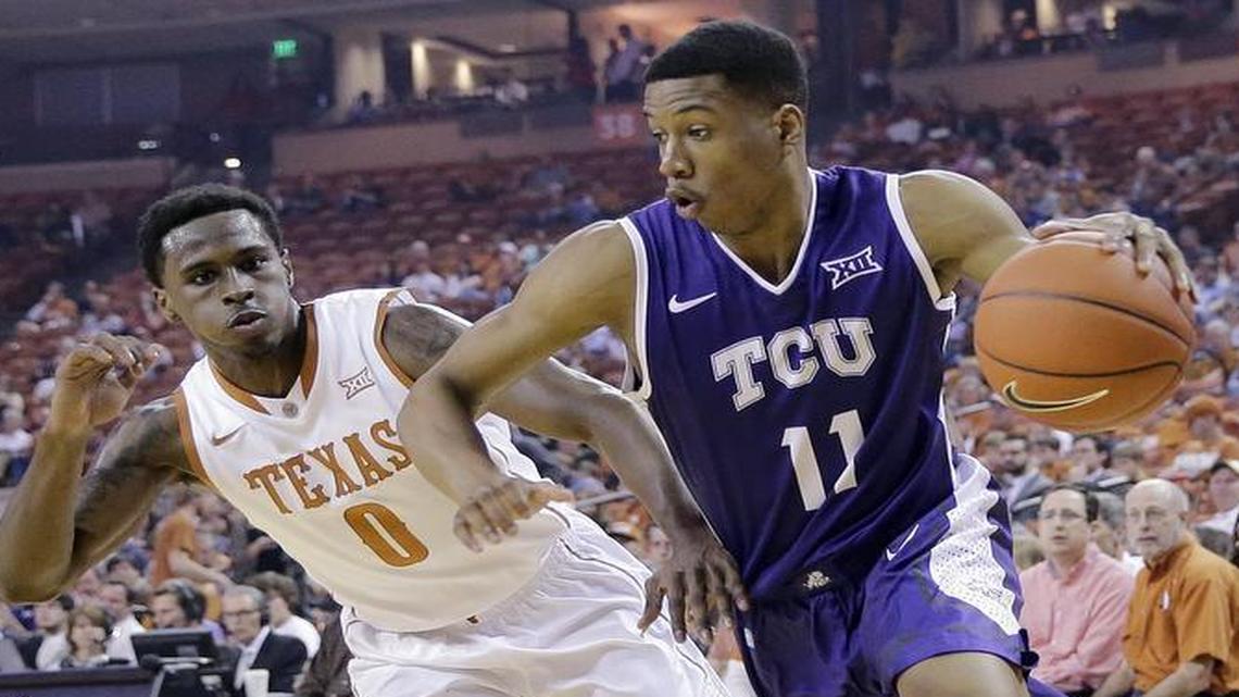 TCU guard Brandon Parrish drives around Texas’ Kendal Yancey during a Big 12 game last season in Austin. Parrish is one of the three most experienced veterans for the Horned Frogs this season.