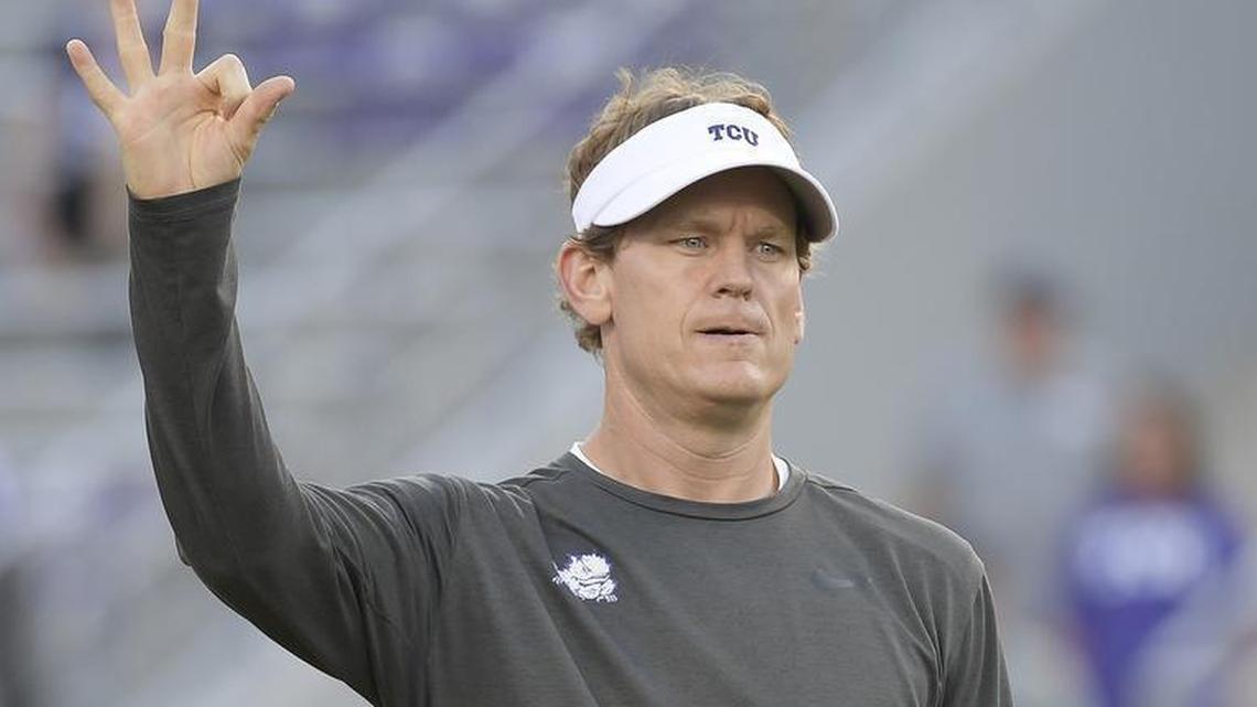 TCU co-offensive coordinator Sonny Cumbie signals during pregame activities against Texas on Nov. 4 at Amon G. Carter Stadium.