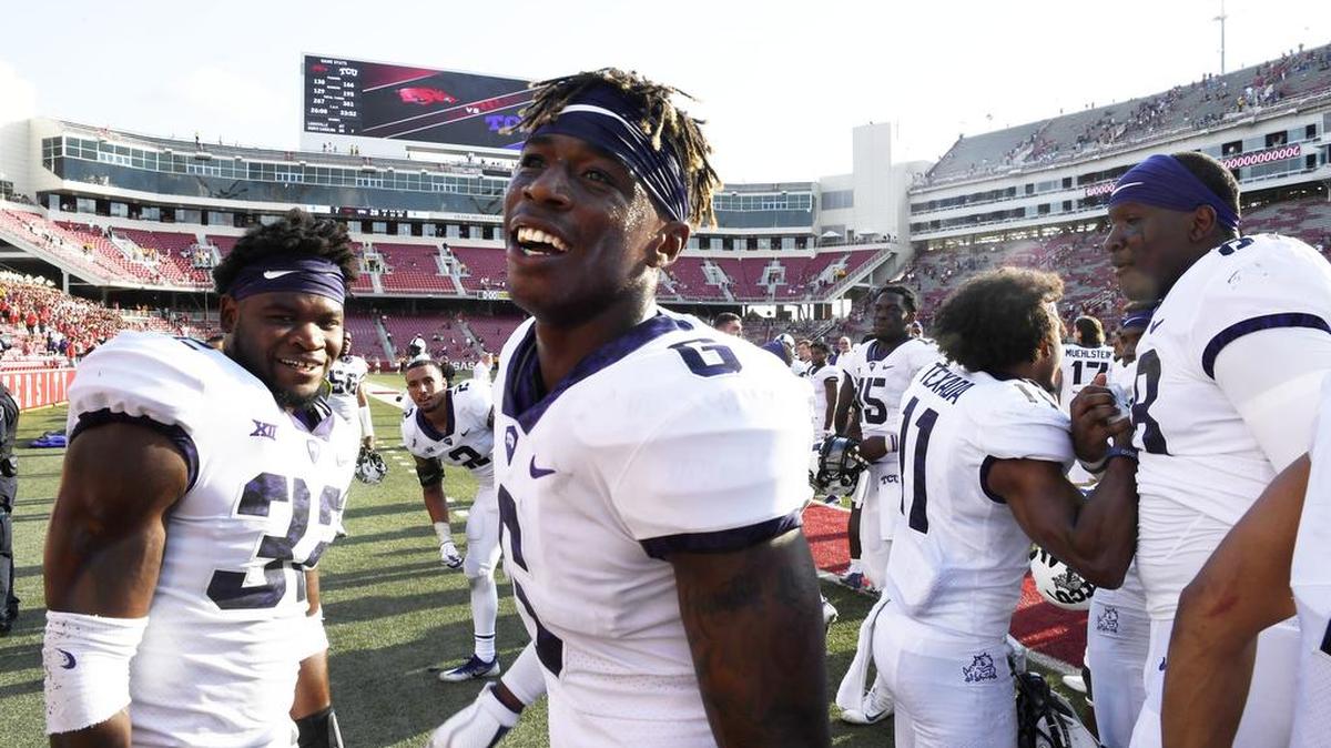 TCU safety Innis Gaines and linebacker Travin Howard celebrate their 28-7 victory against Arkansas in Fayetteville. It was the first of six games this season for TCU against teams it lost to last season.