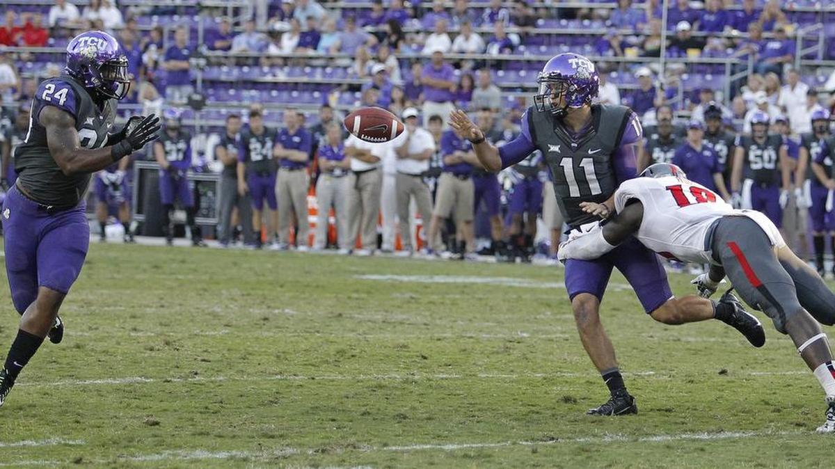 TCU quarterback Zach Allen (right) makes a pitch to running back Trevorris Johnson in a 2014 game against Texas Tech. Allen, who switched to receiver in 2015, announced Thursday he is transfering.