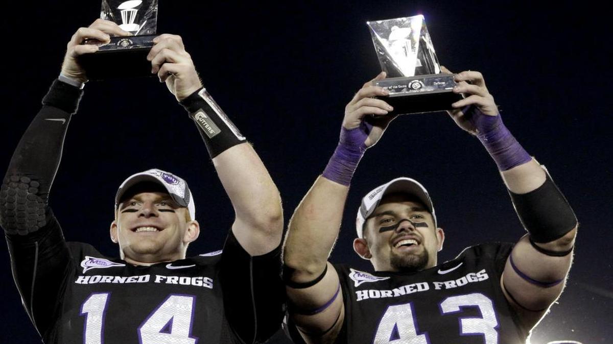 Rose Bowl MVPs Andy Dalton and Tank Carder (right) helped put TCU on a track to landing a spot in the Big 12. Dalton went on to become the starting quarterback for the Bengals, while Carder’s time with the Browns ended in the spring. He is healthy and hopes to land one more NFL deal.