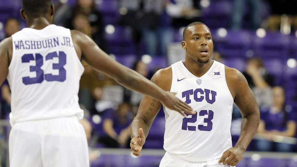 TCU center Devonta Abron gets a hand slap from teammate Chris Washburn after a basket in the opening minutes against Oklahoma State. The Horned Frogs won 63-56 but have dropped two games since.
