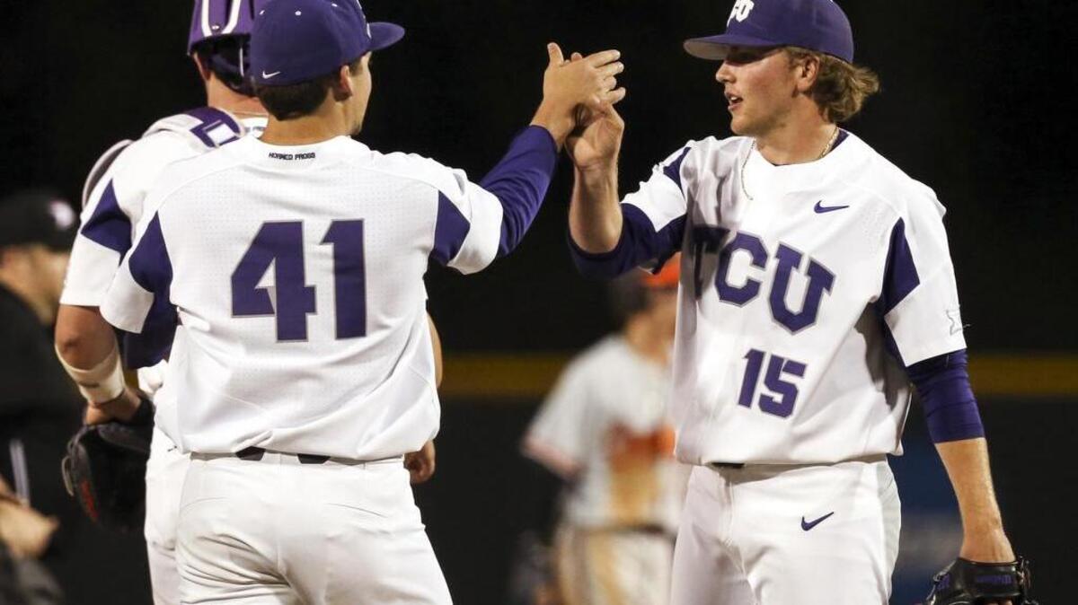 TCU closer Durbin Feltman (right) shares congratulations with pitcher Jared Janczak after a March 24 victory against Oklahoma State at Lupton Stadium.