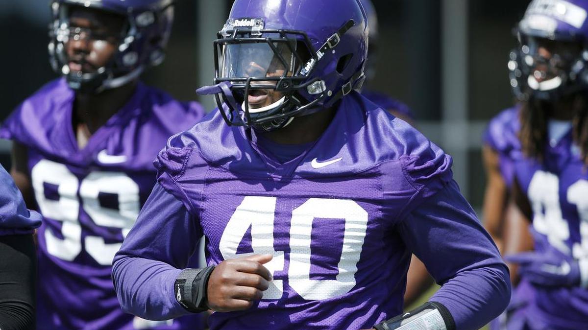 TCU defensive end James McFarland goes through a drill with teammates during practice Friday.