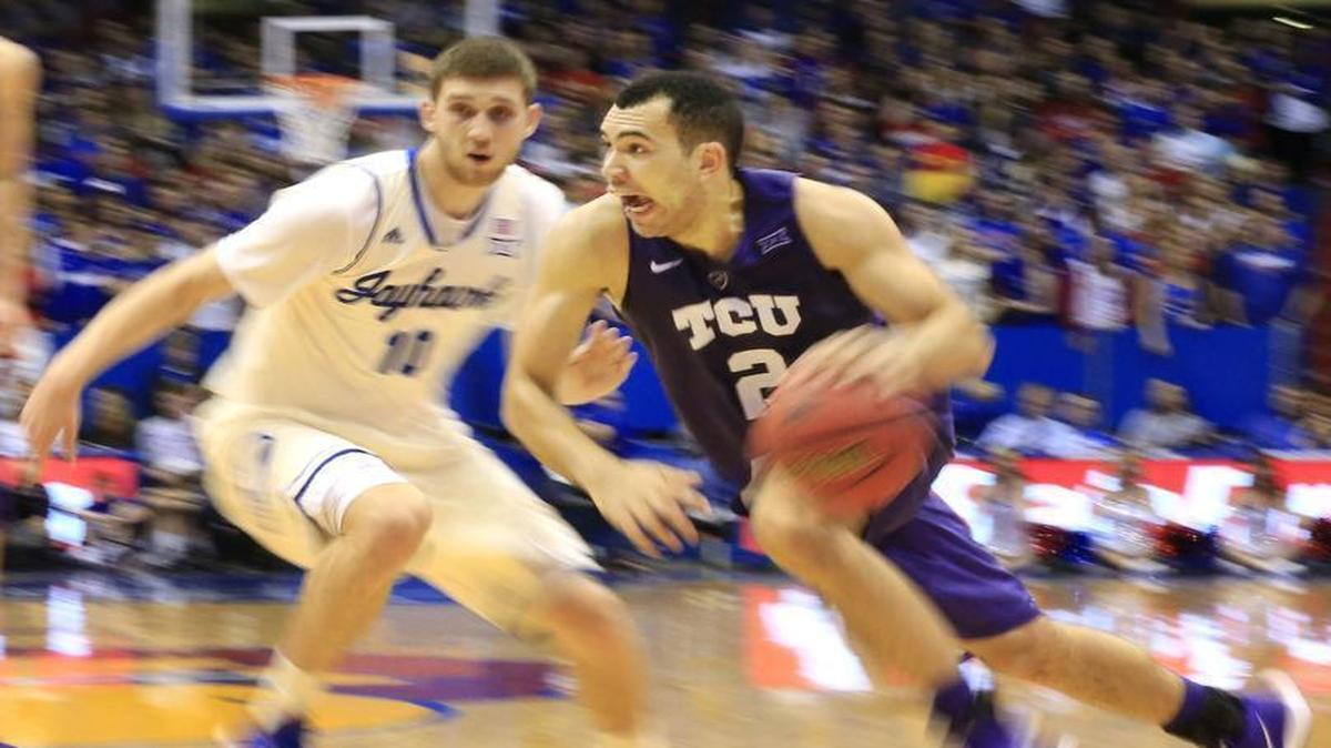 TCU guard Mike Williams drives against Kansas in second-half action at Allen Fieldhouse on Saturday. Williams scored a career-high 13 points in the Horned Frogs’ 70-63 loss.