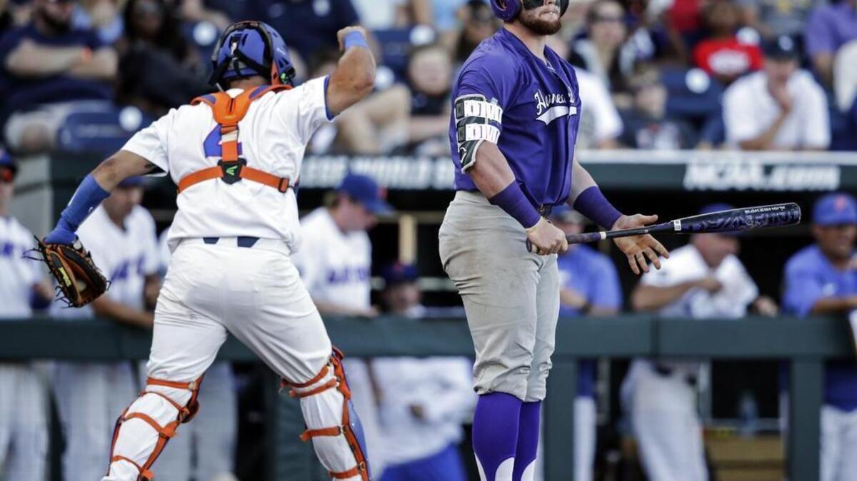 Florida catcher Mike Rivera reacts after a strikeout of TCU catcher Evan Skoug with the bases loaded to end the third inning.