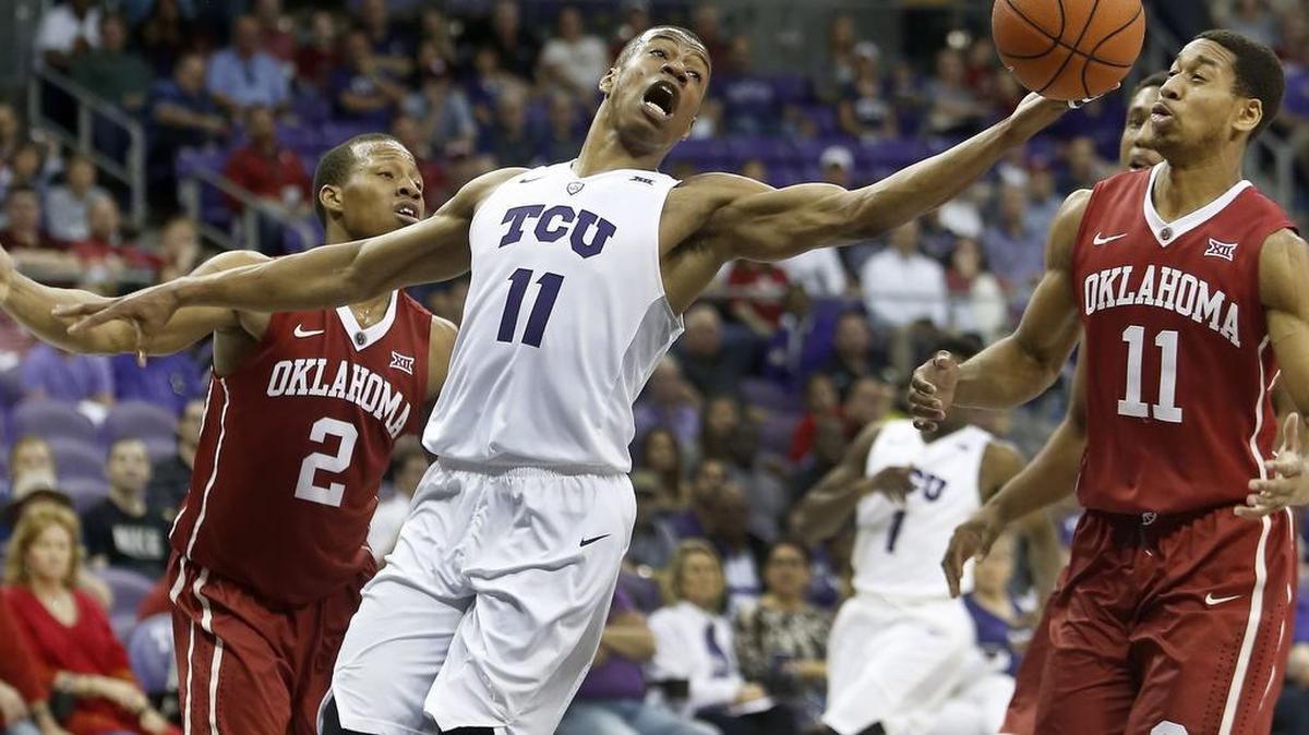 TCU guard Brandon Parrish fights for control of the ball after a foul by Oklahoma guard Isaiah Cousins during the second half of a game last season at Schollmaier Arena.