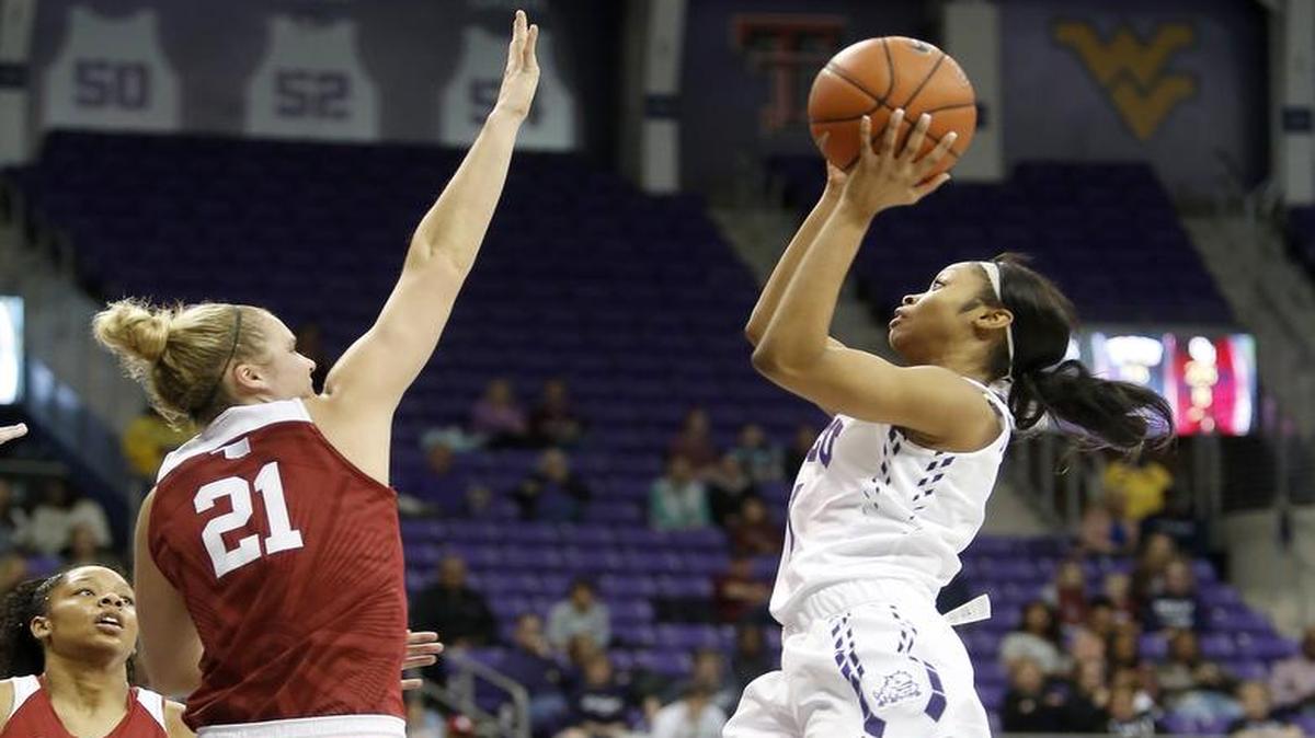 TCU guard Toree Thompson (1) pulls up for a shot against Oklahoma guard Gabbi Ortiz (21) in the first half of an NCAA basketball game at Schollmaier Arena.