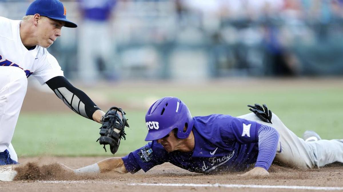 TCU baserunner Nolan Brown is tagged out attempting to dive back to first base in the fourth inning against Florida. The Horned Frogs made three outs on the bases in a 3-0 loss Sunday night at the College World Series.