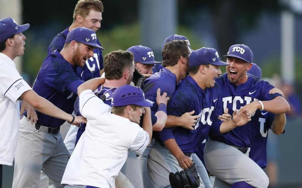 TCU pitcher Sean Wymer is charged by teammates after striking out the final hitter in an 8-1 victory against Missouri State to clinch a Super Regional series, resulting in the Horned Frogs’ fourth consecutive trip to the College World Series.